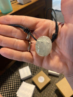 Clear Quartz with inclusions leather necklace.